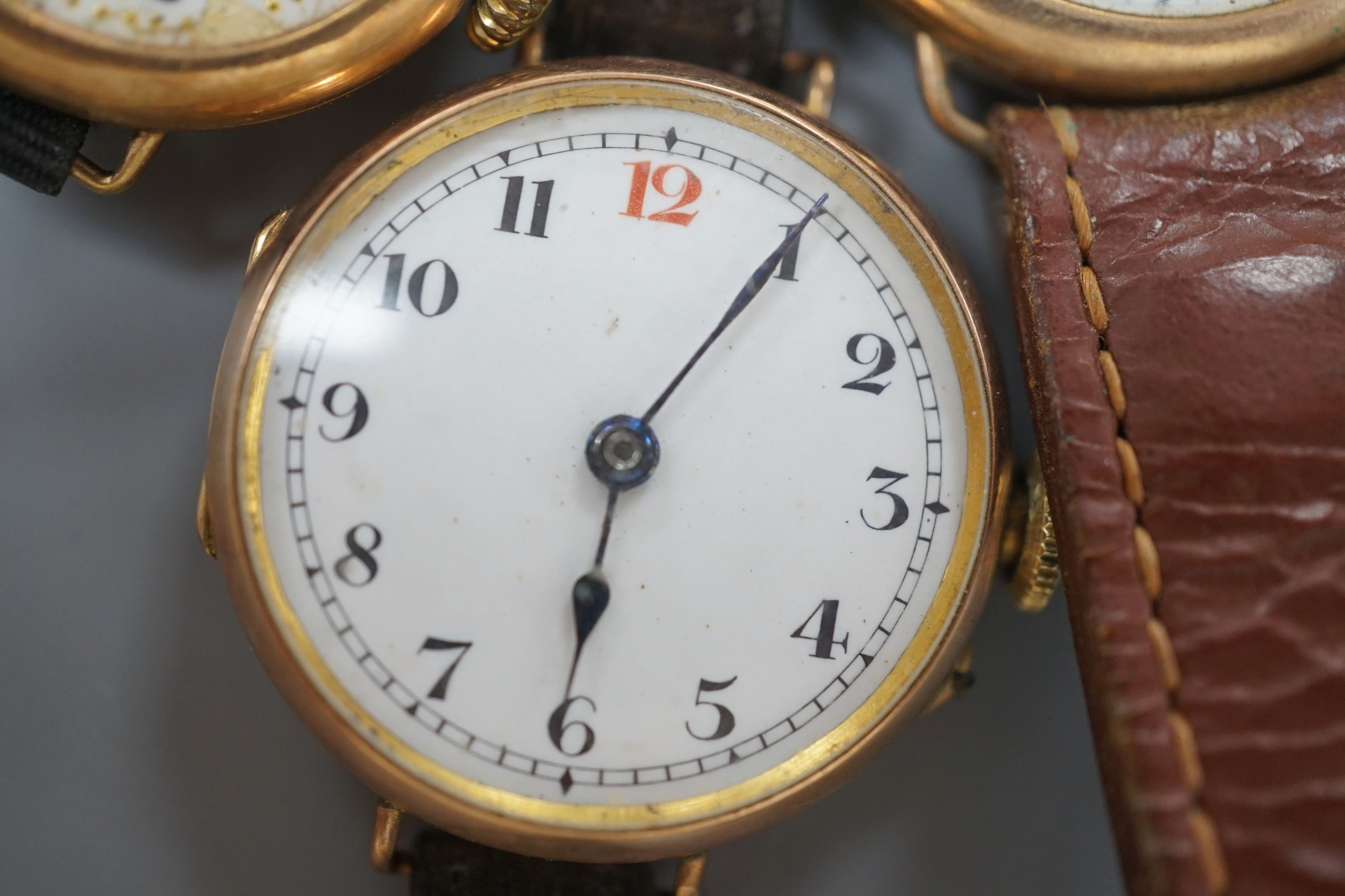 Four assorted early 20th century 9ct gold manual wind wrist watches, all a.f.